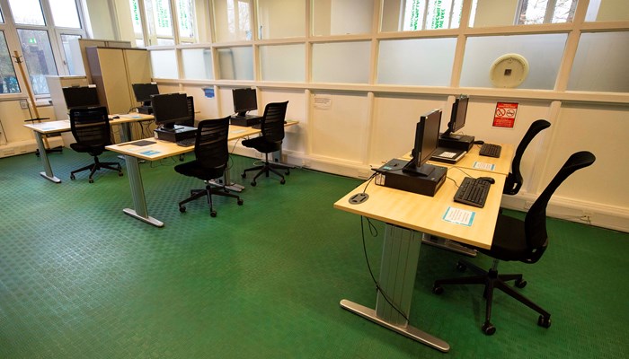 PC area with 3 tables and 2 PC's at each table.